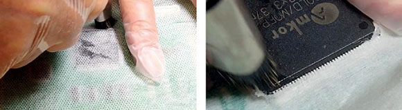 Figure 4. Cleaning through or around QFPs with wipes.